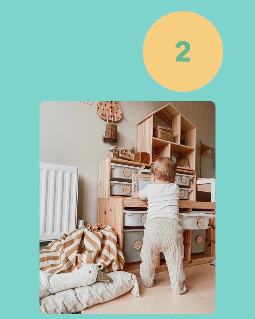 Our Own Hygge Confetti Playmat in Beige Baby Standing at Play Kitchen
